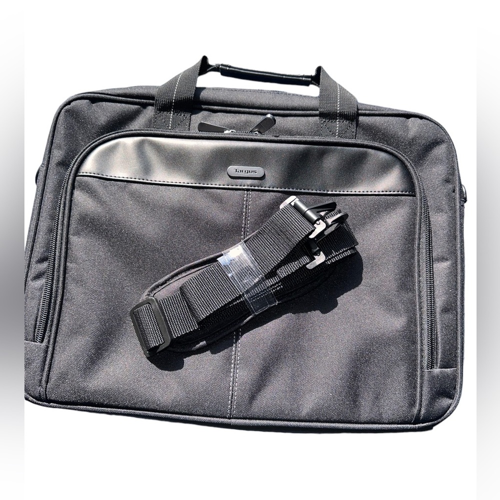 Black never used laptop bag with shoulder and hand straps.
